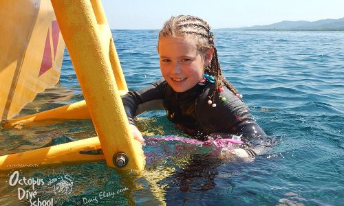 Child taking the PADI Bubblemaker course in Roatan, Honduras